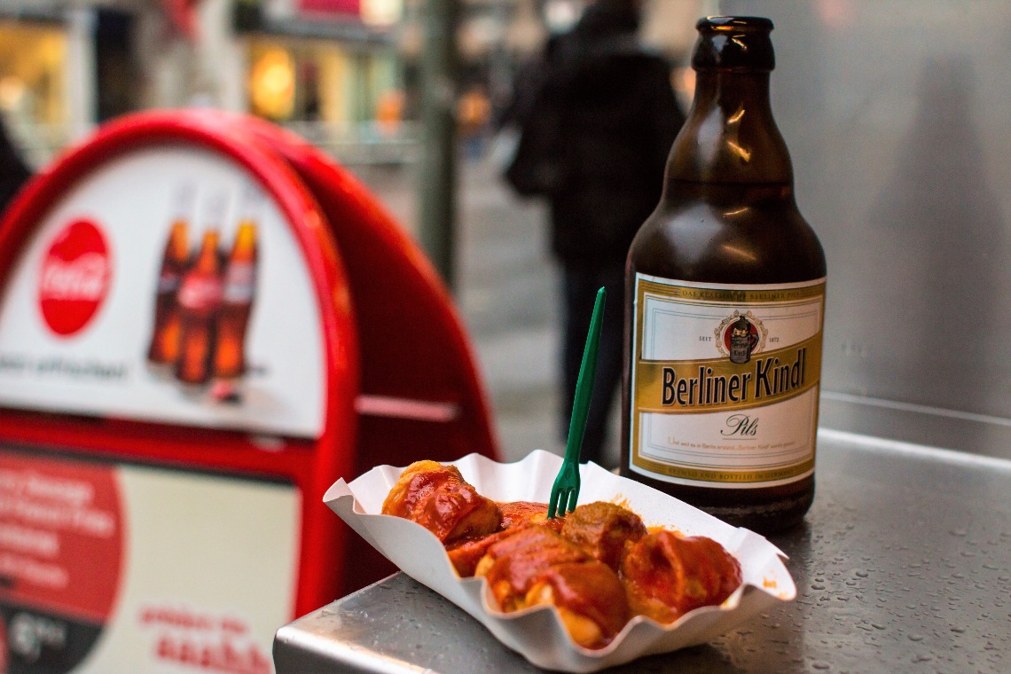 A bottle of Berliner Beer and a serving of currywurst